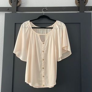 Silky cream colored blouse with gold button detail